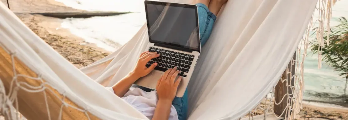 young-beautiful-woman-lying-hammock-with-laptop-resort-mock-up-blank-white-screen